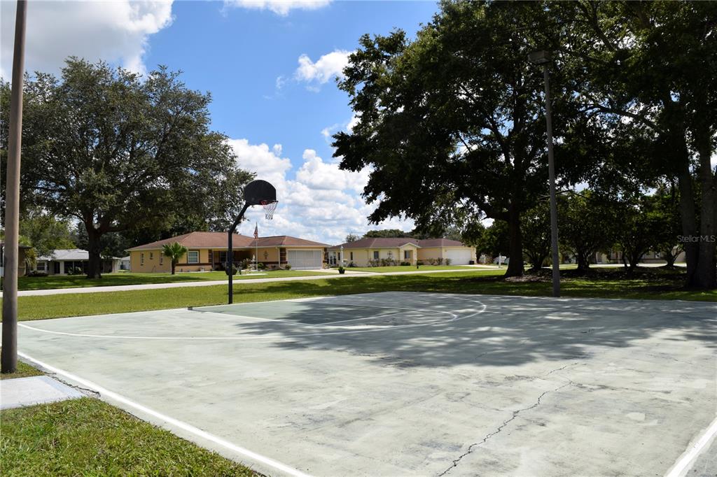 5968 Southwest 103rd Loop Ocala, FL 34476 - Photo 45 of 48 a view of outdoor space with playground and green space