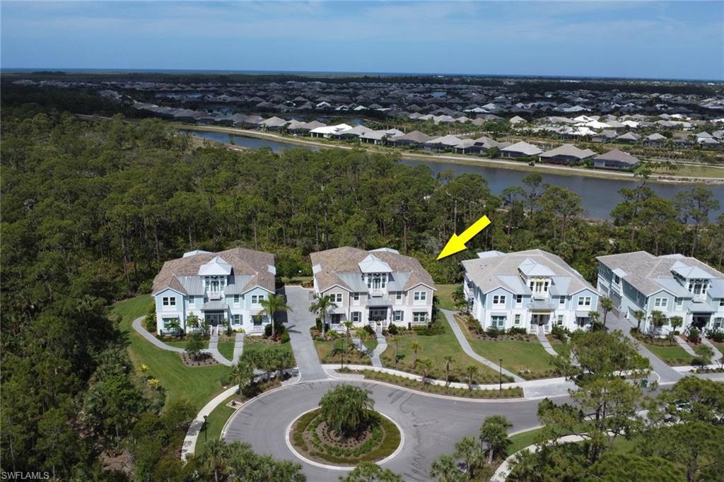 6509 Dominica Drive, Unit 101 Naples, FL 34113 - Photo 2 of 33 an aerial view of residential houses with outdoor space