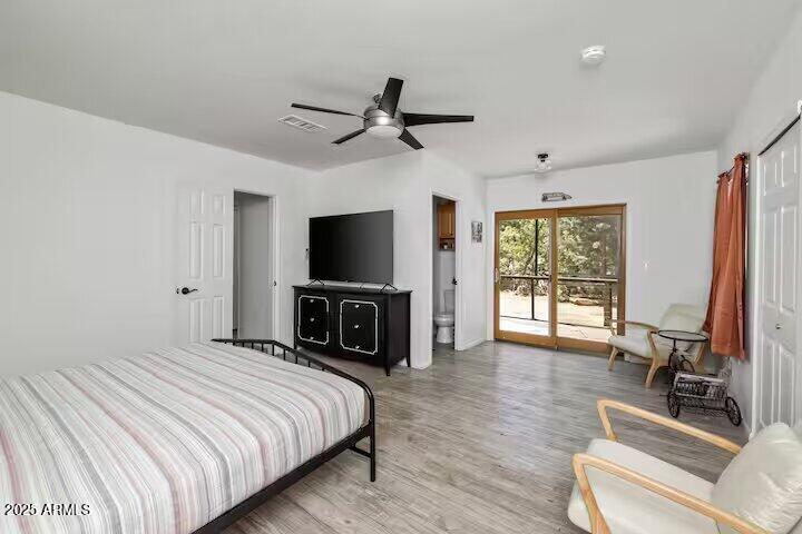 1822 Idylwild Road Prescott, AZ 86305 - Photo 19 of 25 a bedroom with a bed and a flat screen tv