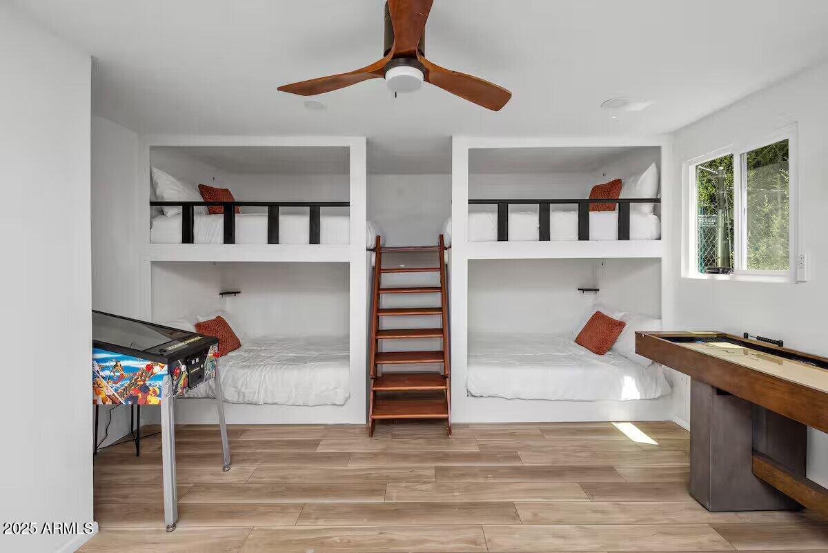 1822 Idylwild Road Prescott, AZ 86305 - Photo 21 of 25 a bedroom with furniture and a book shelf