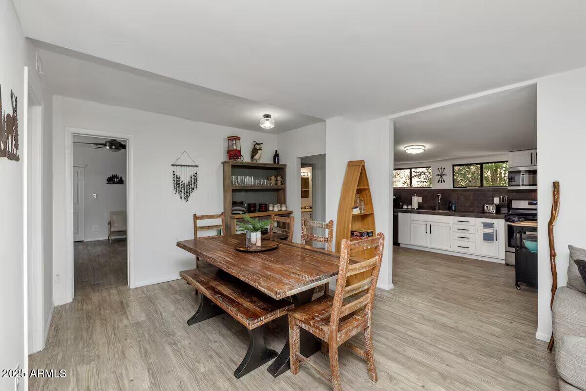 1822 Idylwild Road Prescott, AZ 86305 - Photo 4 of 25 a living room with stainless steel appliances furniture a rug and a kitchen view