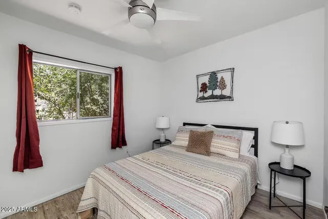 a bedroom with a bed and a window