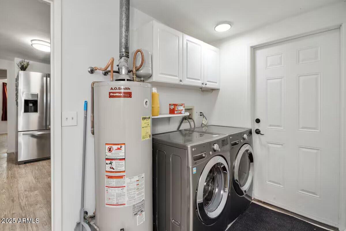 1822 Idylwild Road Prescott, AZ 86305 - Photo 6 of 25 a view of washer and dryer with kitchen in the background