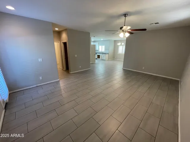 an empty room with wooden floor