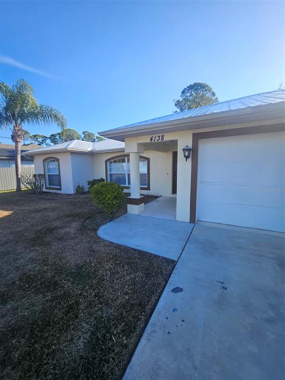 4138 Azora Street North Port, FL 34291 - Photo 2 of 37 front view of a house with a yard