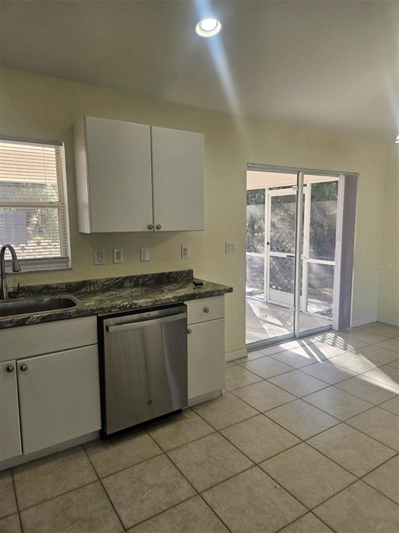 4138 Azora Street North Port, FL 34291 - Photo 22 of 37 a kitchen with stainless steel appliances granite countertop a sink and a cabinets