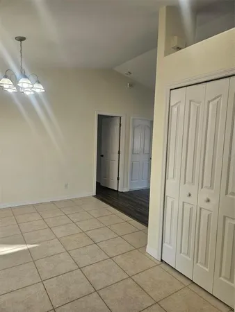 a view of a utility room with cabinets