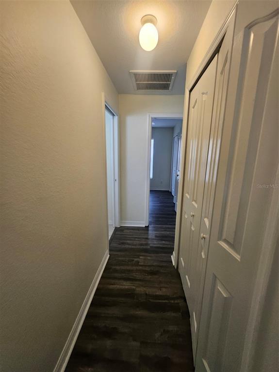 4138 Azora Street North Port, FL 34291 - Photo 26 of 37 a view of a hallway with wooden floor and staircase