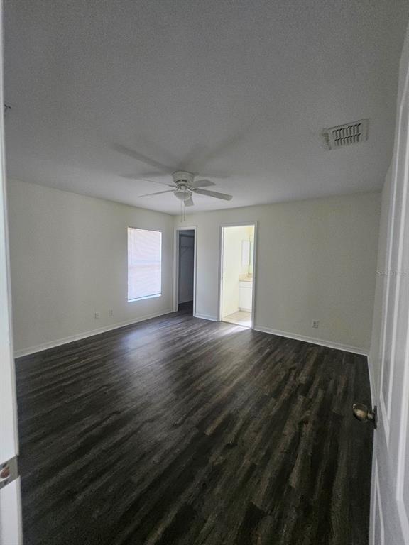 4138 Azora Street North Port, FL 34291 - Photo 27 of 37 an empty room with wooden floor and windows