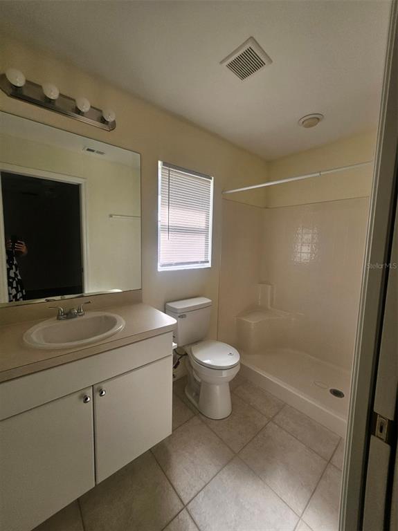 4138 Azora Street North Port, FL 34291 - Photo 28 of 37 a bathroom with a sink toilet and shower