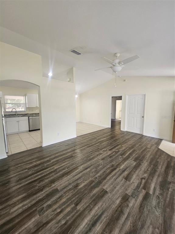 4138 Azora Street North Port, FL 34291 - Photo 6 of 37 an empty room with wooden floor and windows