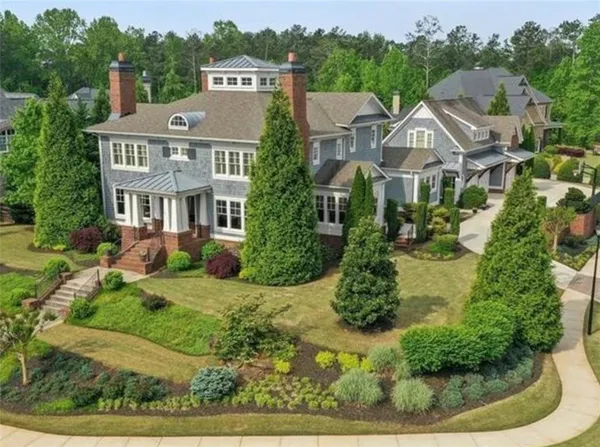 an aerial view of a house with a garden and plants
