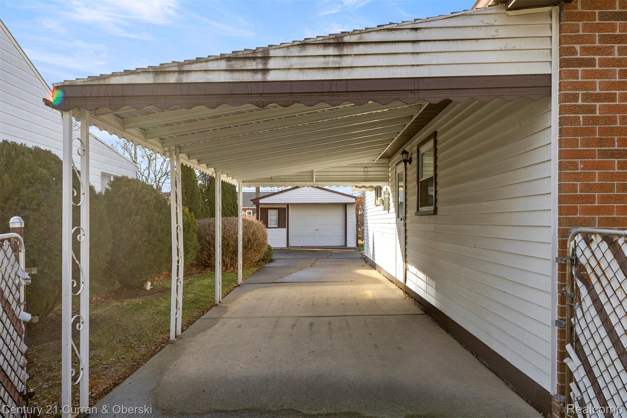7120 Jackson Street Taylor, MI 48180 - Photo 4 of 24 View of vehicle parking with a carport and a garage