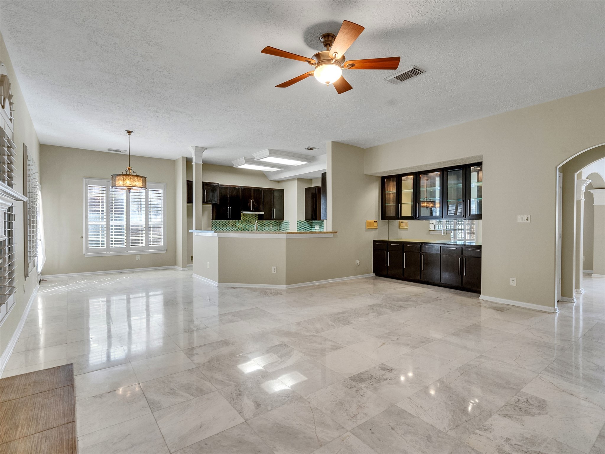 4414 Santee Drive Baytown, TX 77521 - Photo 17 of 50 a view of an empty room with a window and a kitchen