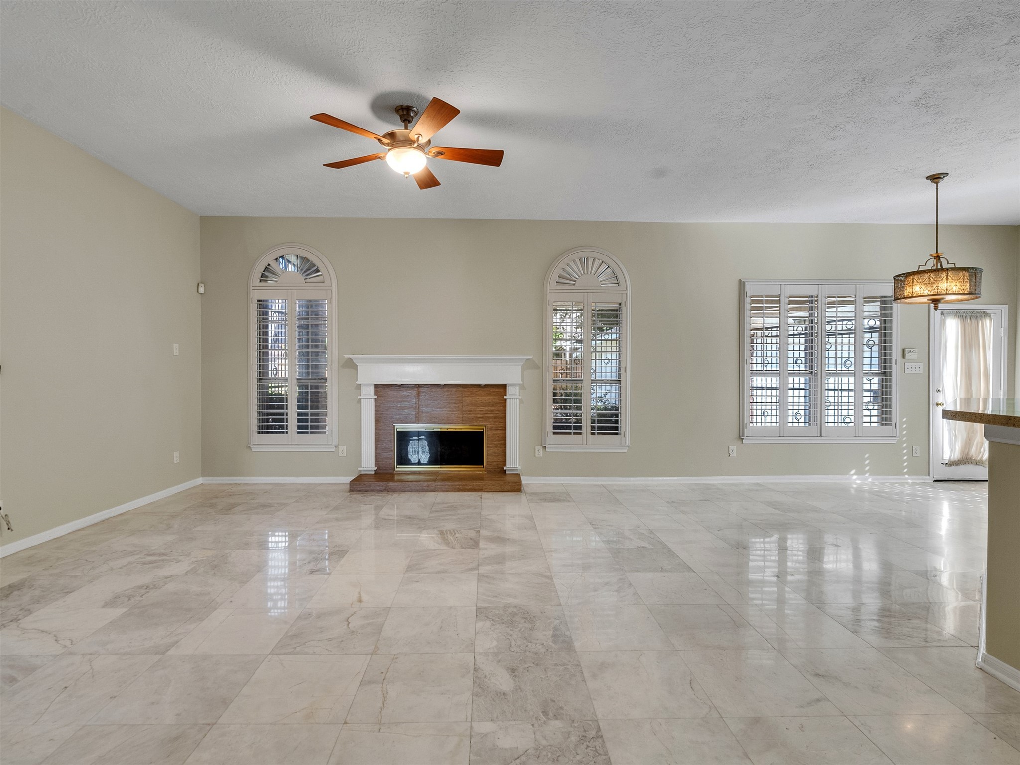4414 Santee Drive Baytown, TX 77521 - Photo 20 of 50 an empty room with windows and fireplace