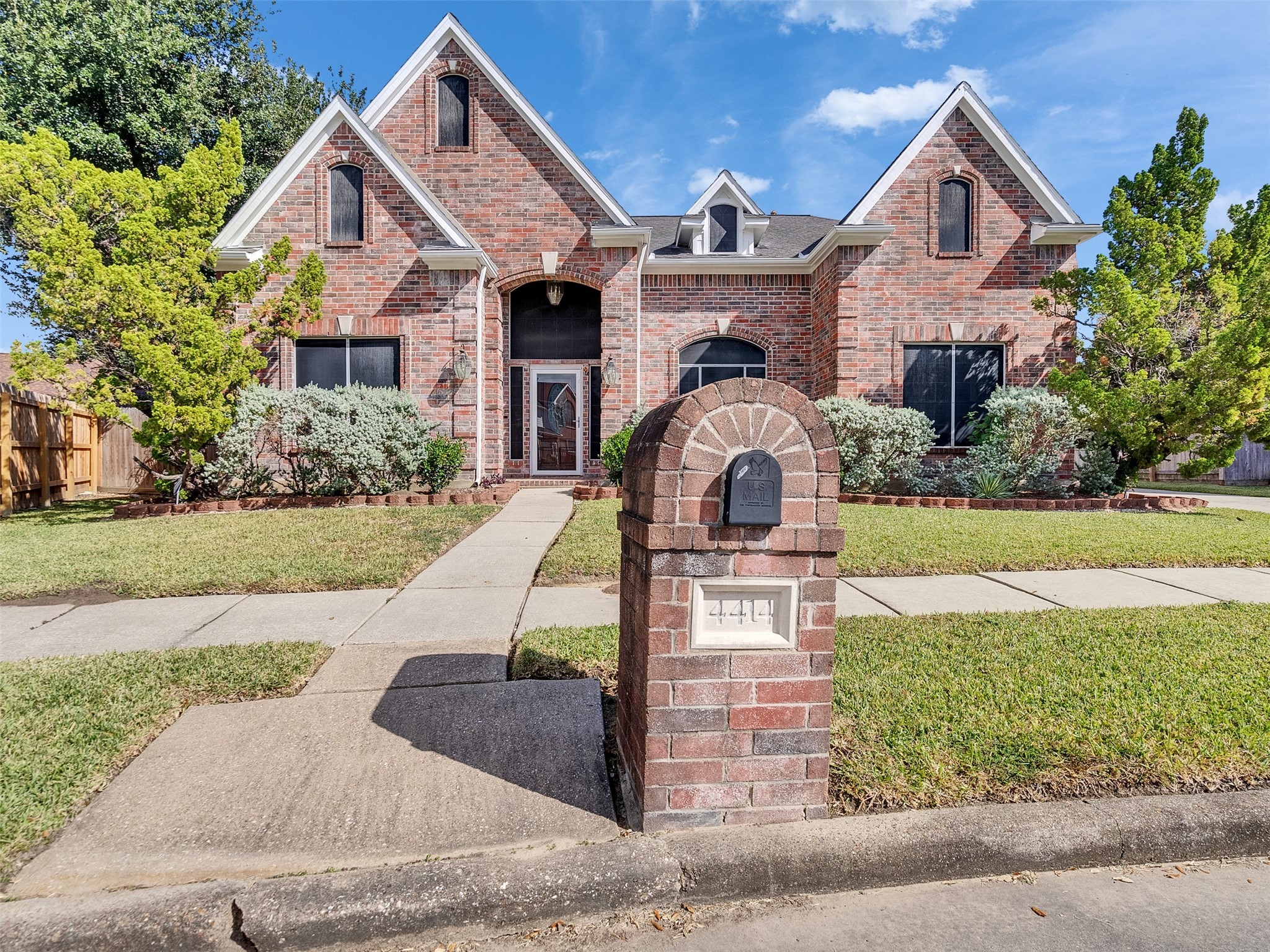 4414 Santee Drive Baytown, TX 77521 - Photo 2 of 50 a front view of a house with a yard