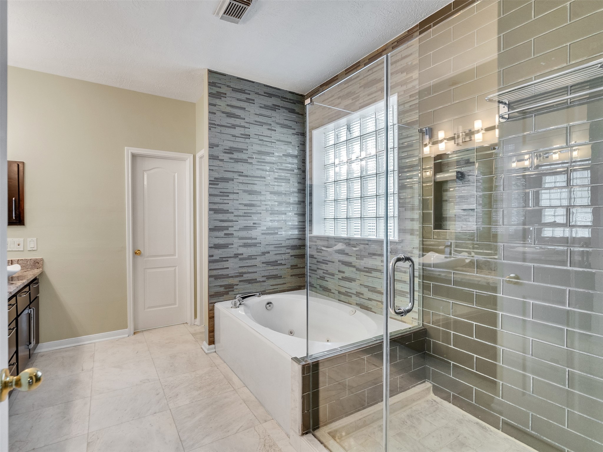 4414 Santee Drive Baytown, TX 77521 - Photo 23 of 50 a bathroom with a tub and shower
