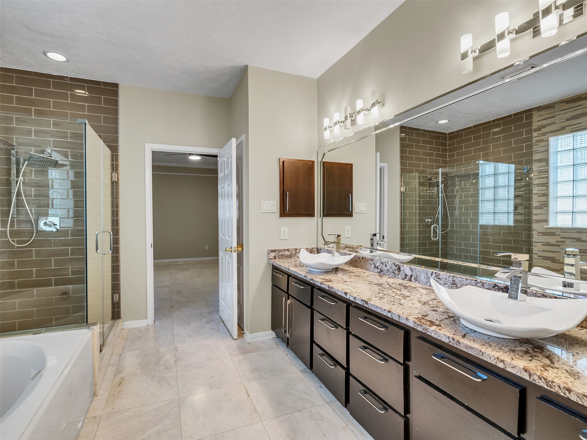 4414 Santee Drive Baytown, TX 77521 - Photo 24 of 50 a bathroom with a granite countertop sink mirror and shower