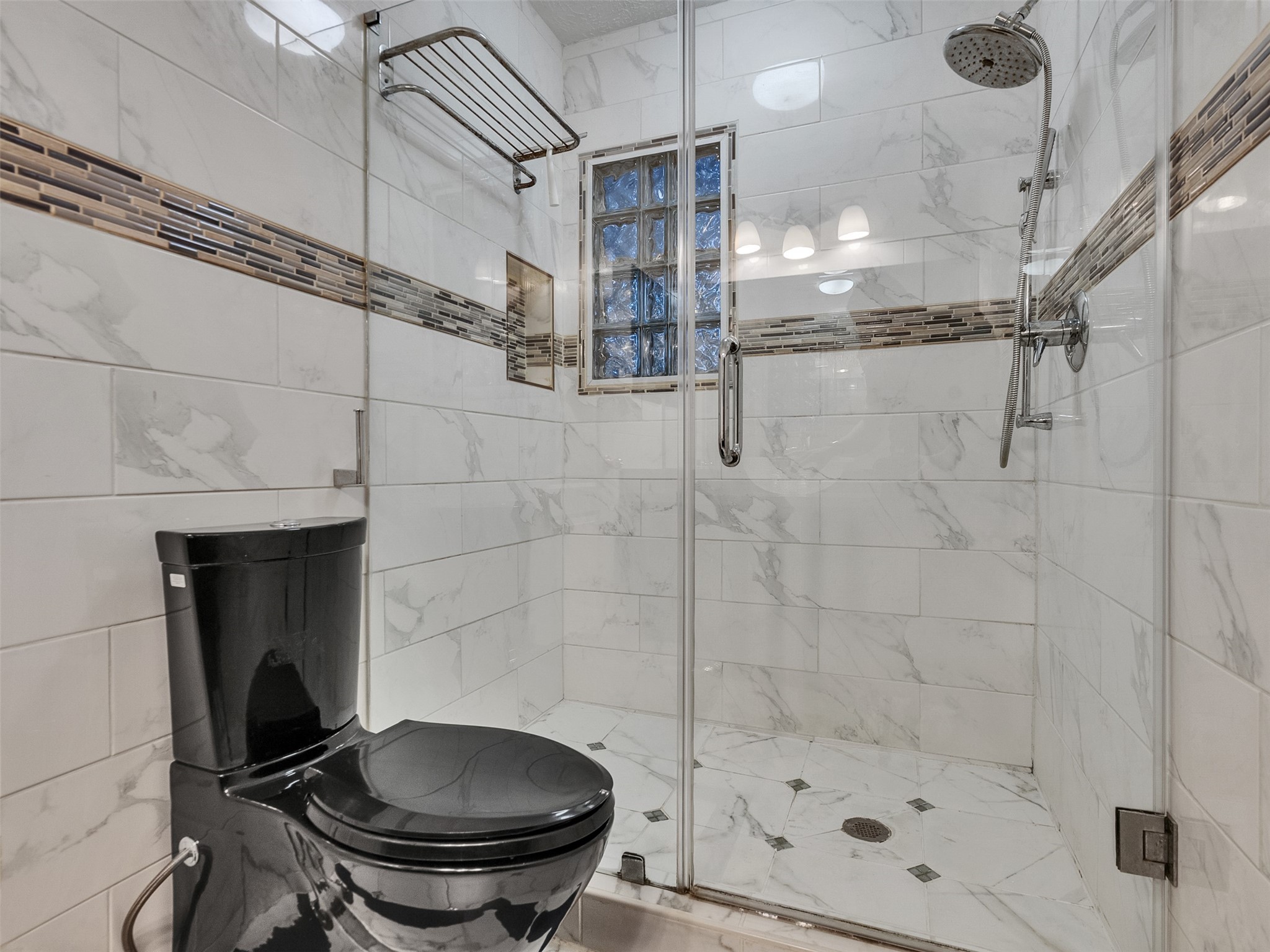 4414 Santee Drive Baytown, TX 77521 - Photo 40 of 50 a bathroom with a toilet and a shower