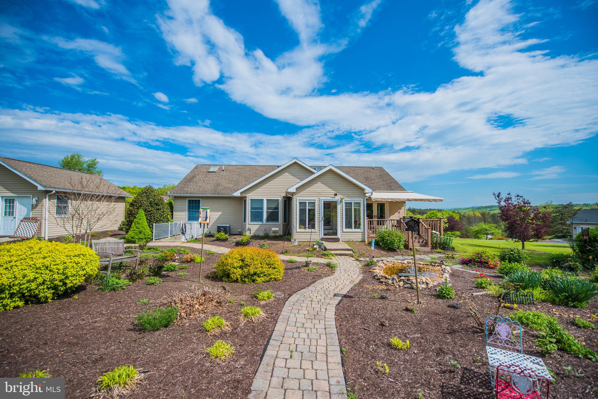 358 Ridge View Drive Berkeley Springs, WV 25411 - Photo 2 of 50 Back of house with landscaping