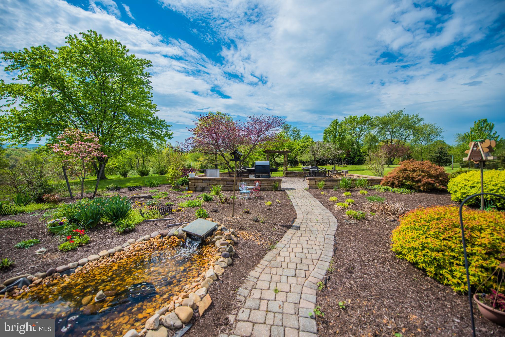 358 Ridge View Drive Berkeley Springs, WV 25411 - Photo 3 of 50 stone walkway to stone patio