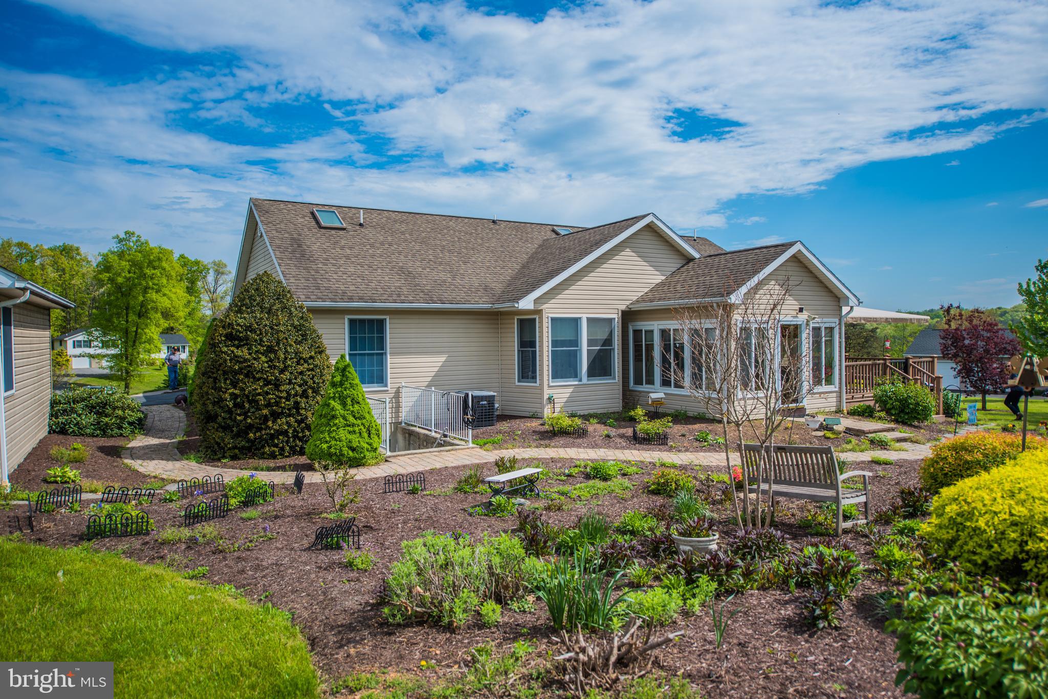 358 Ridge View Drive Berkeley Springs, WV 25411 - Photo 21 of 50 Back yard with beautiful landscaping