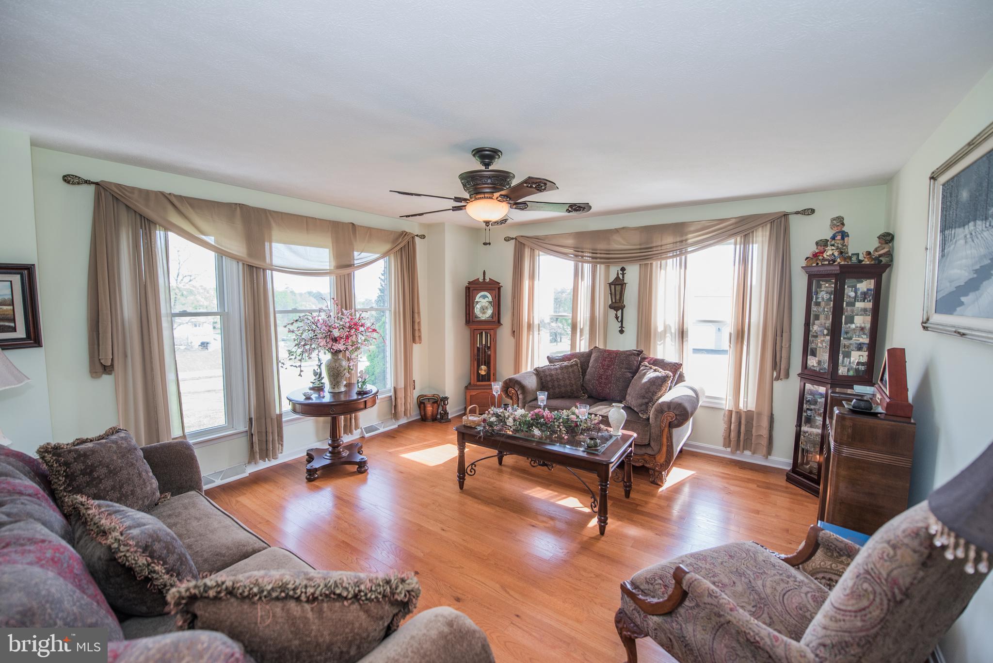 358 Ridge View Drive Berkeley Springs, WV 25411 - Photo 5 of 50 well lighted living room with wood floors