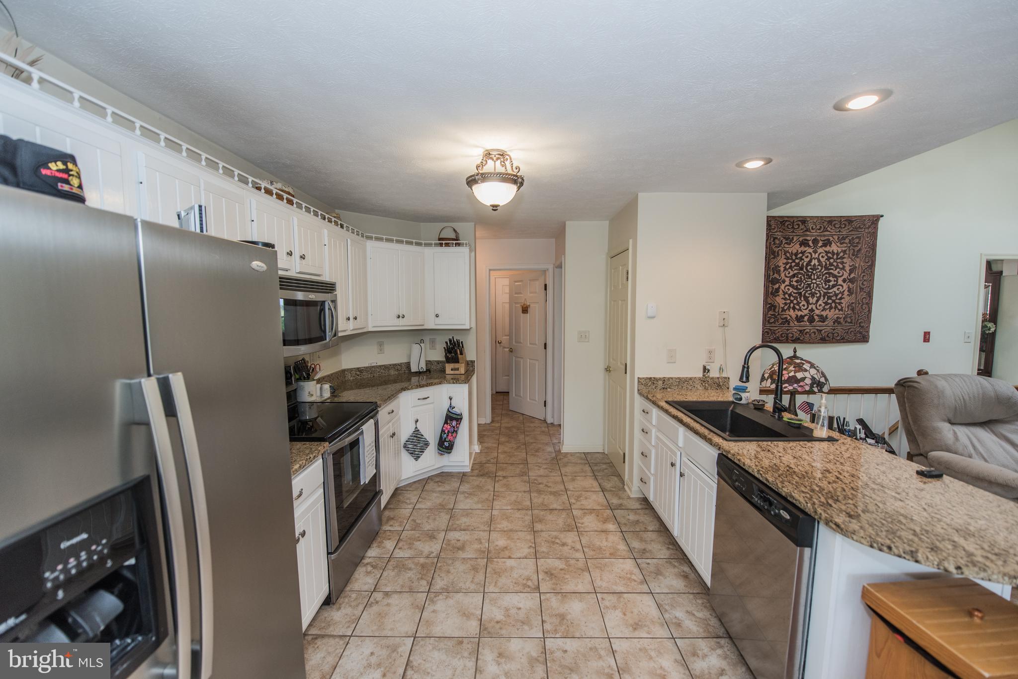 358 Ridge View Drive Berkeley Springs, WV 25411 - Photo 44 of 50 kitchen opens to family