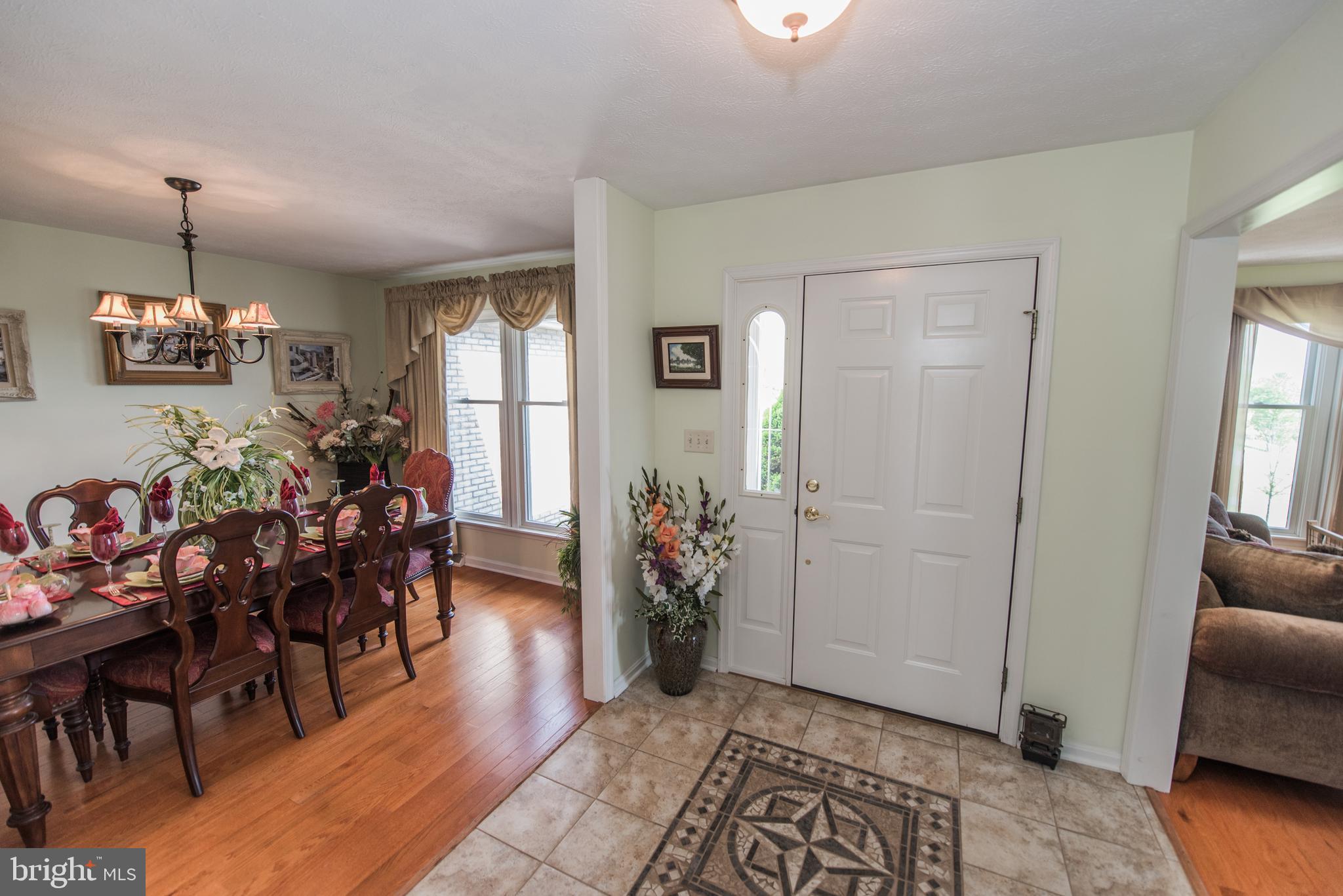 358 Ridge View Drive Berkeley Springs, WV 25411 - Photo 48 of 50 dining room and ceramic tiled foyer w/ front door