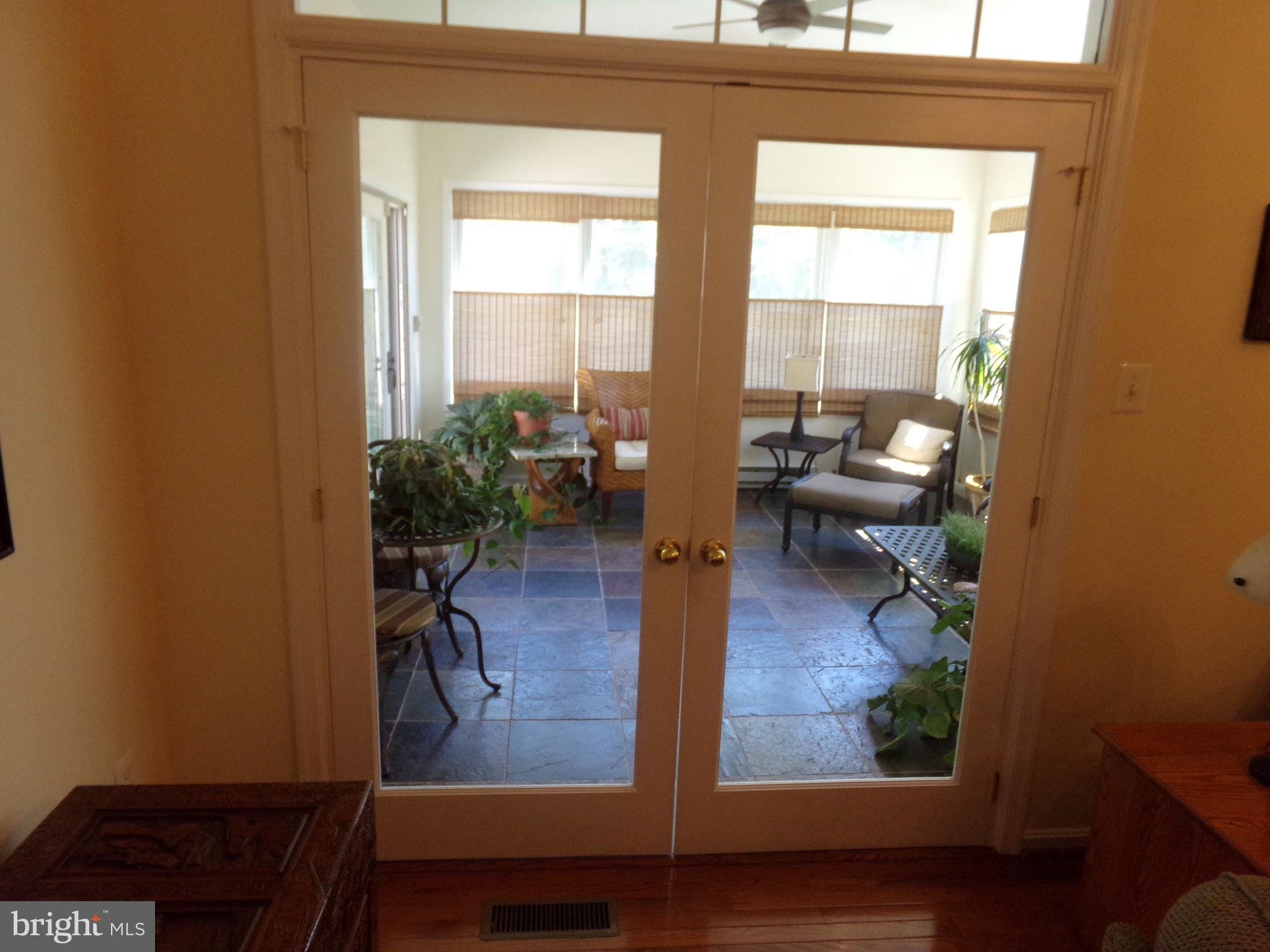 11200 Snowden Pond Road Laurel, MD 20708 - Photo 34 of 63 french doors lead to sunroom