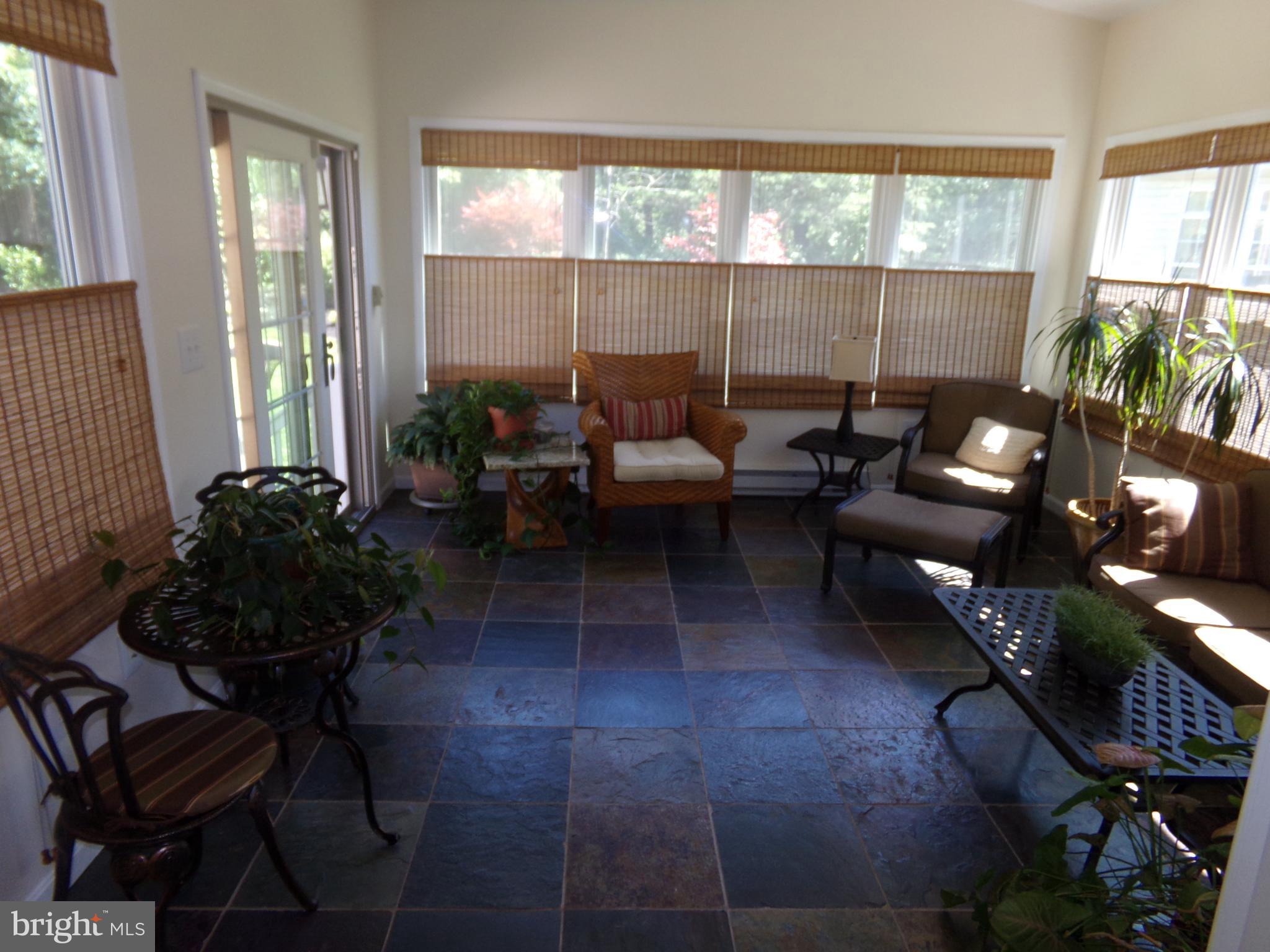 11200 Snowden Pond Road Laurel, MD 20708 - Photo 35 of 63 lovely heated sunroom and furniture conveys