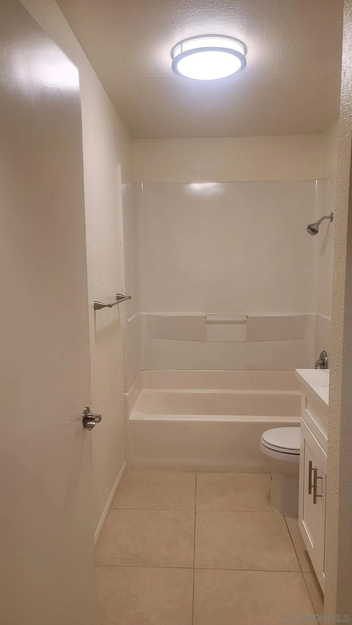 6255 Rancho Mission Road, Unit 102 San Diego, CA 92108 - Photo 7 of 7 a bathroom with a bathtub and a shower