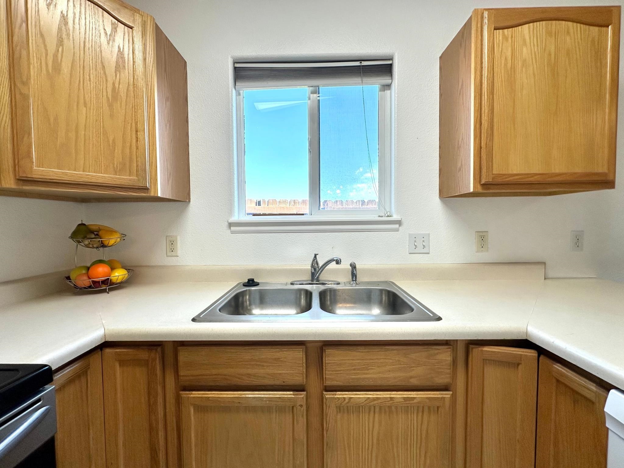656 Springbrook Drive Grand Junction, CO 81504 - Photo 11 of 32 a kitchen with a sink cabinets and a window