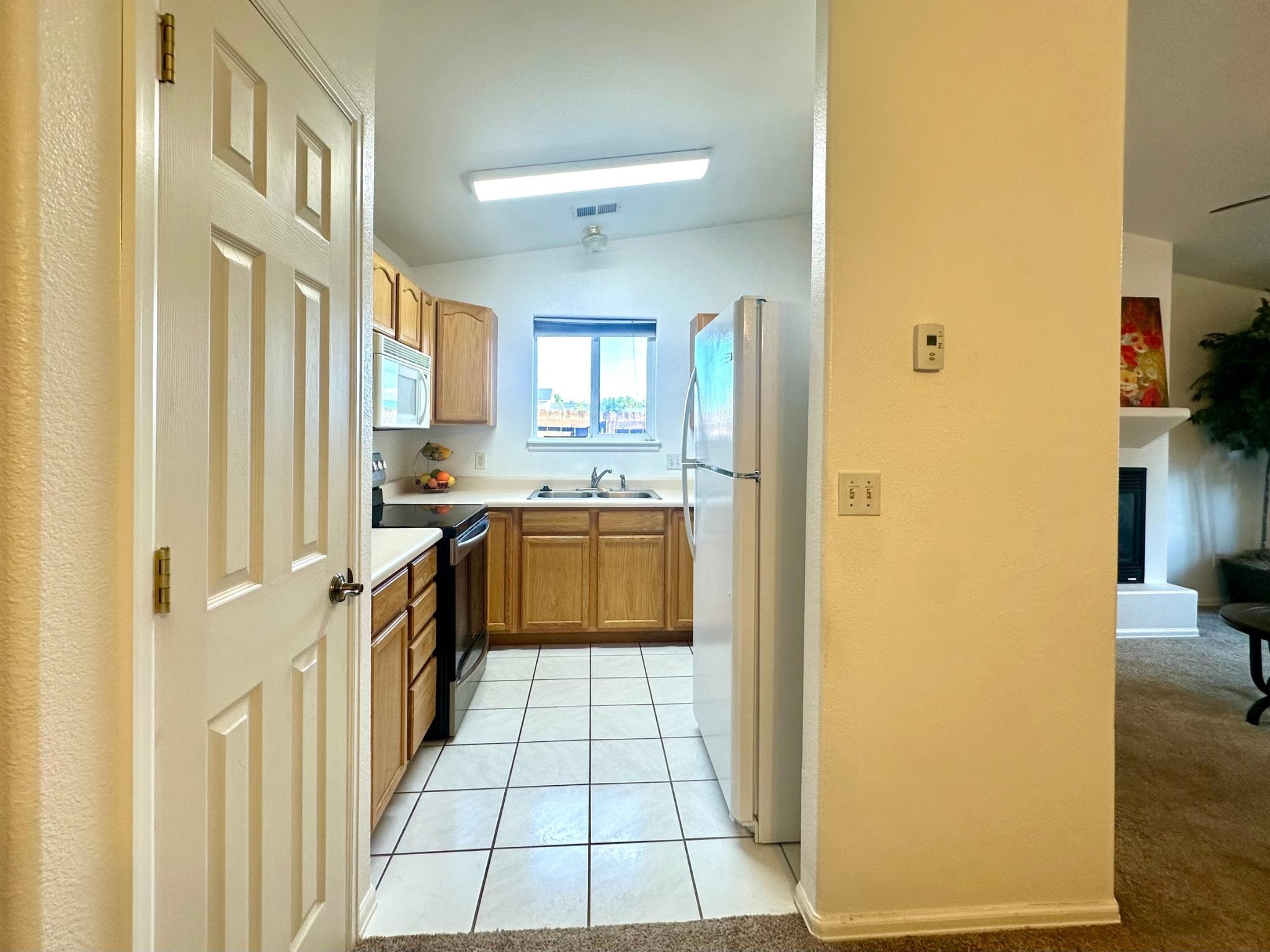 656 Springbrook Drive Grand Junction, CO 81504 - Photo 14 of 32 a kitchen with a sink a counter top space and cabinets