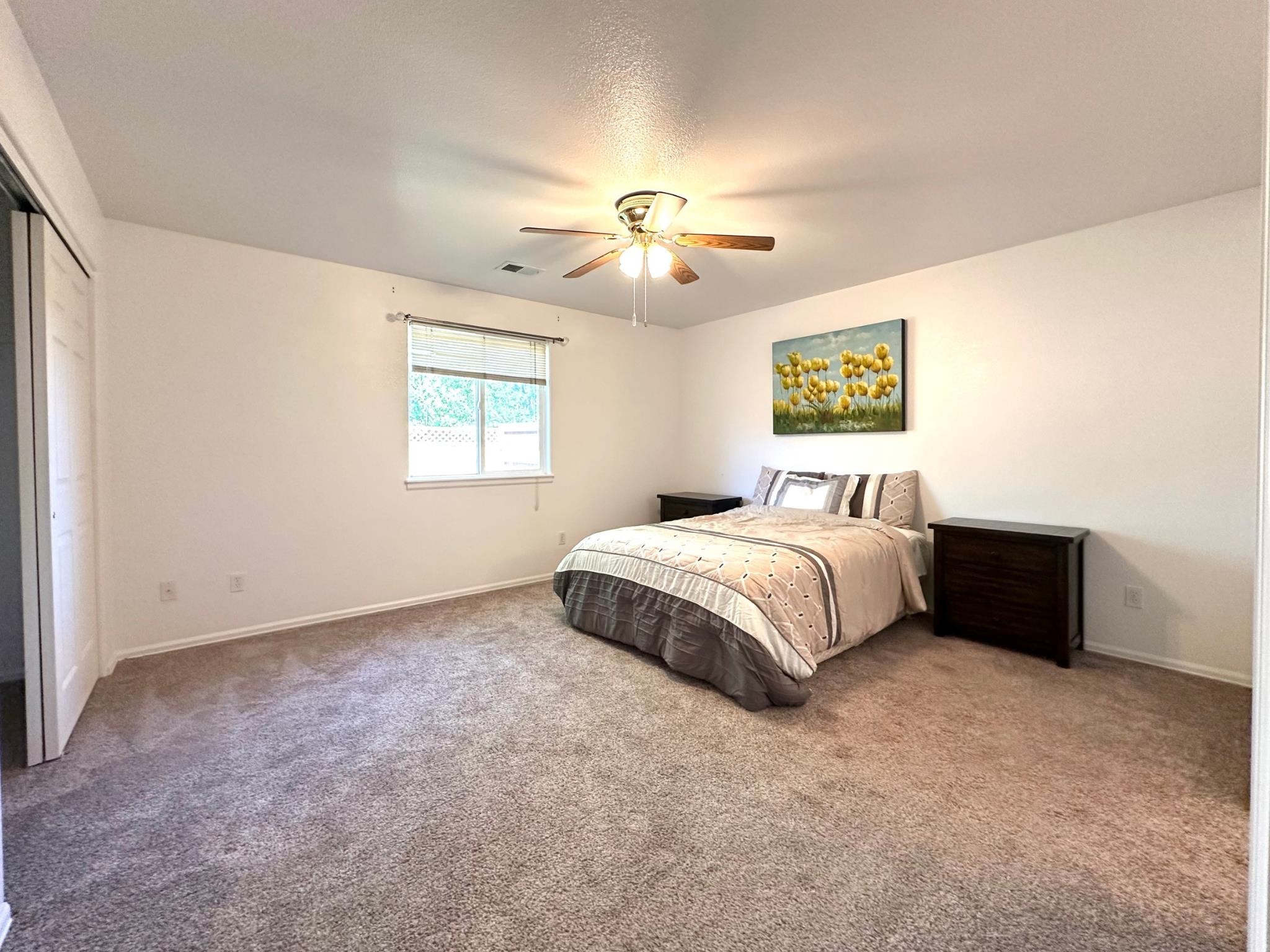 656 Springbrook Drive Grand Junction, CO 81504 - Photo 15 of 32 a bedroom with a bed and a window