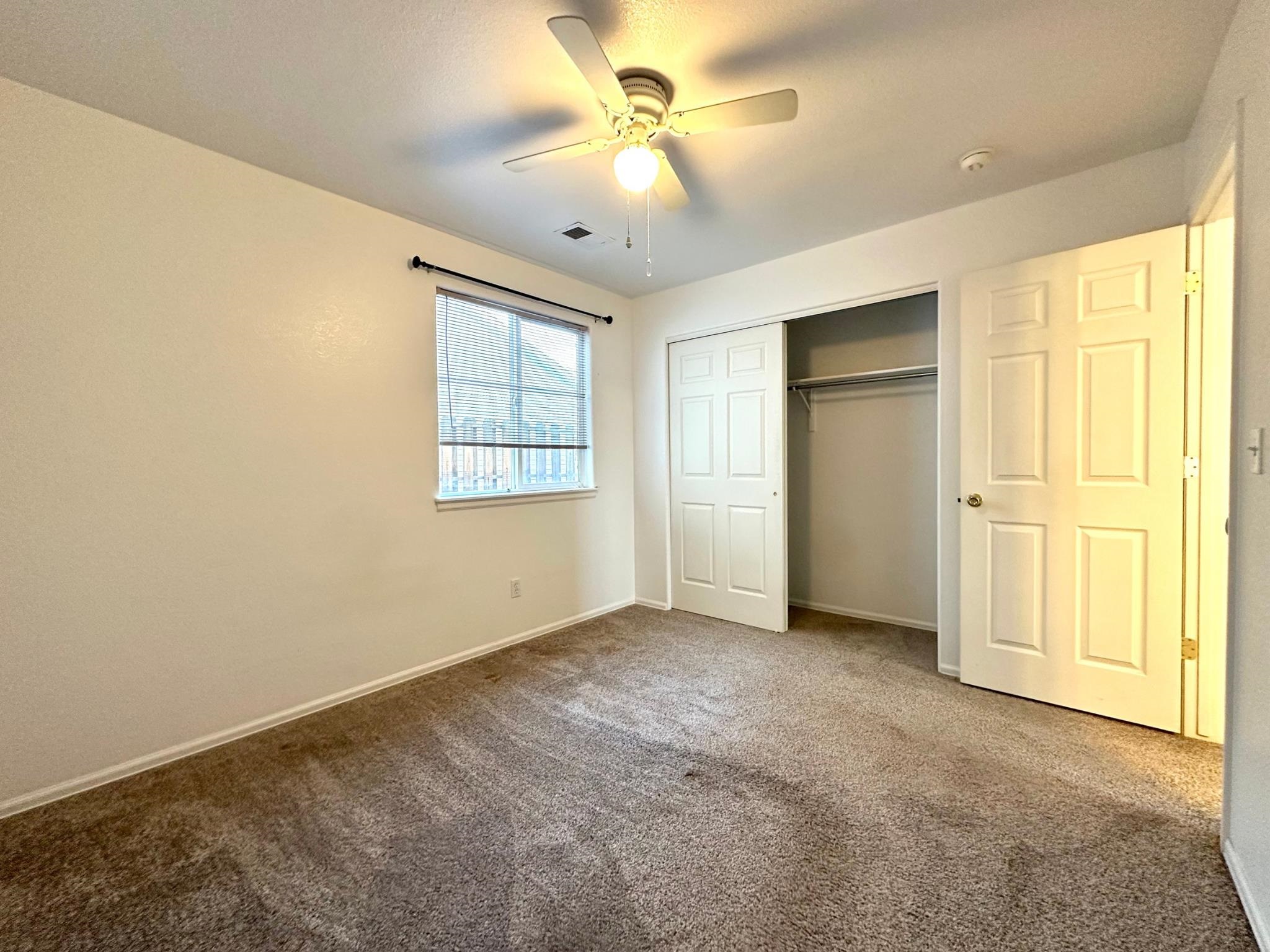 656 Springbrook Drive Grand Junction, CO 81504 - Photo 18 of 32 an empty room with windows and cabinet