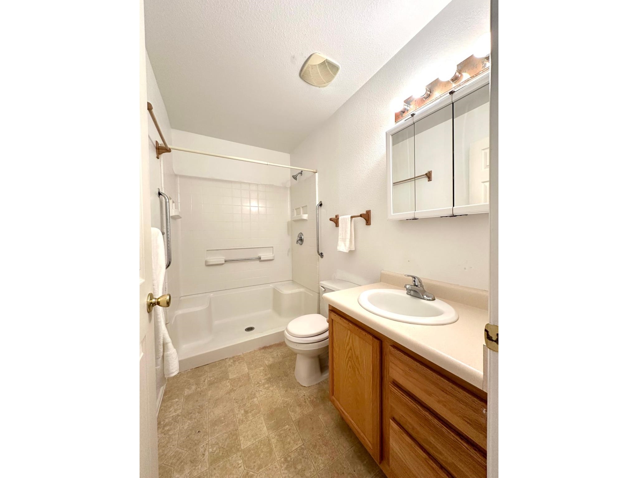 656 Springbrook Drive Grand Junction, CO 81504 - Photo 20 of 32 a bathroom with a sink a toilet and shower