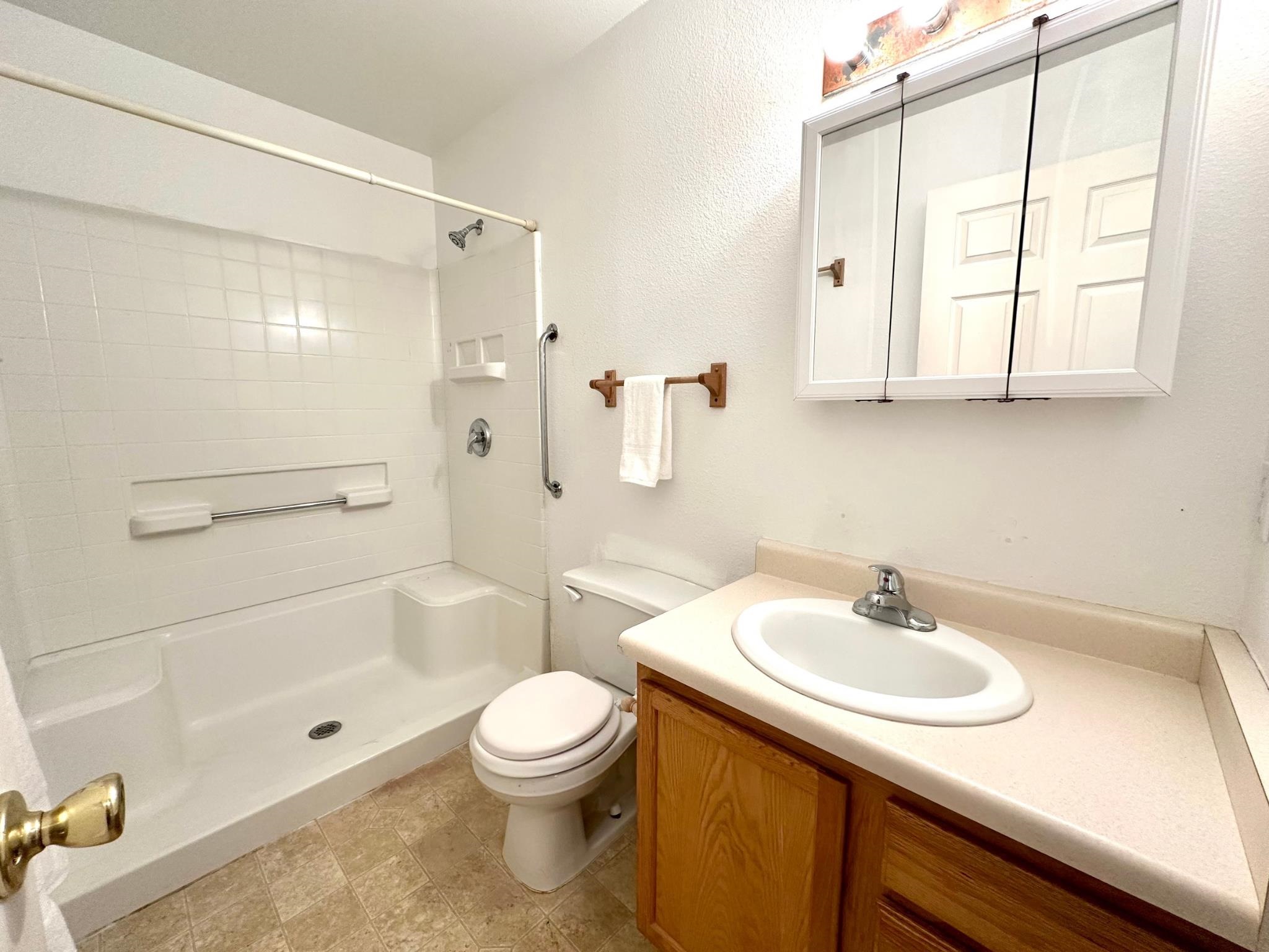 656 Springbrook Drive Grand Junction, CO 81504 - Photo 21 of 32 a bathroom with a sink toilet and shower