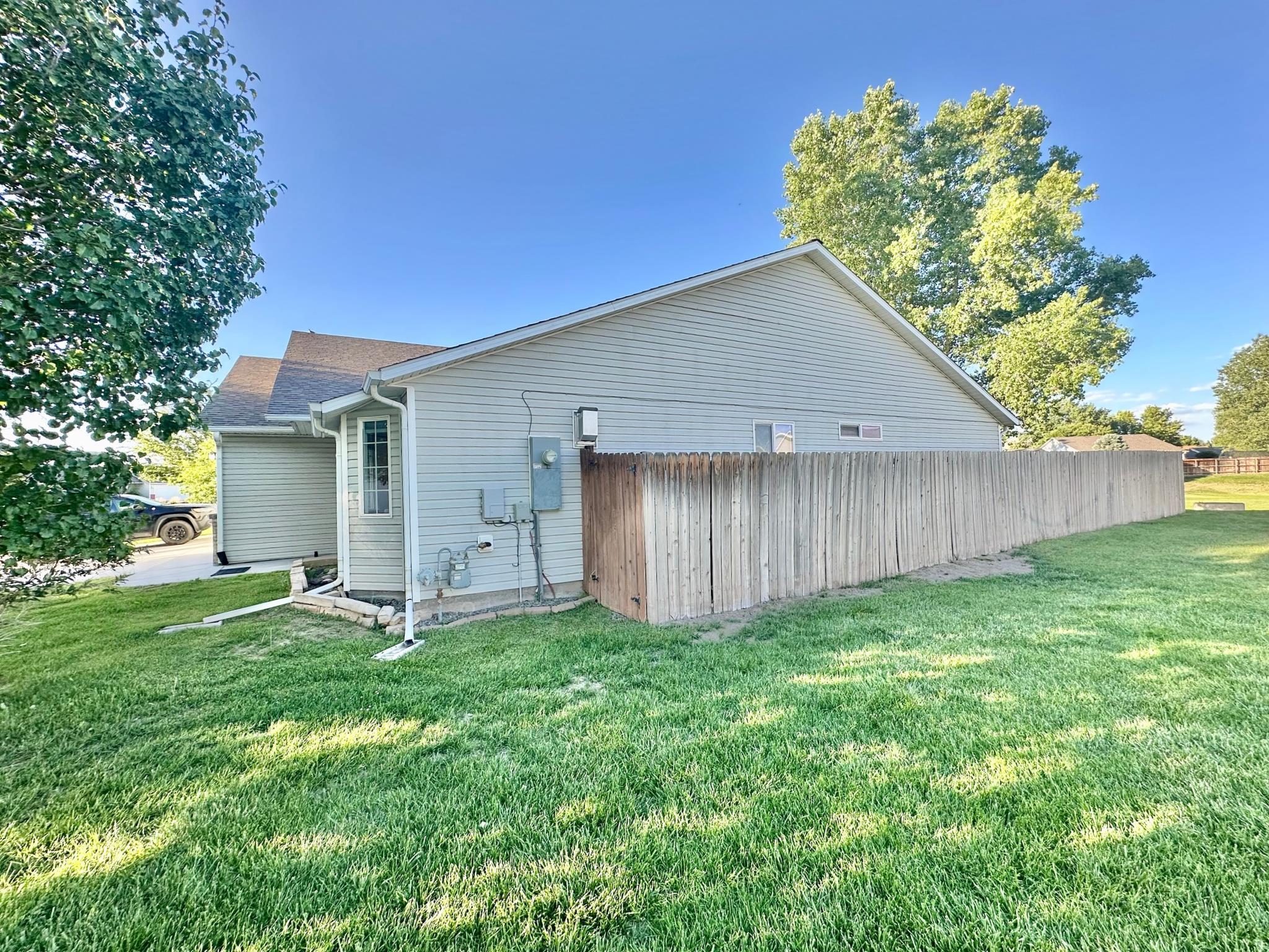 656 Springbrook Drive Grand Junction, CO 81504 - Photo 30 of 32 a backyard of a house with table and chairs
