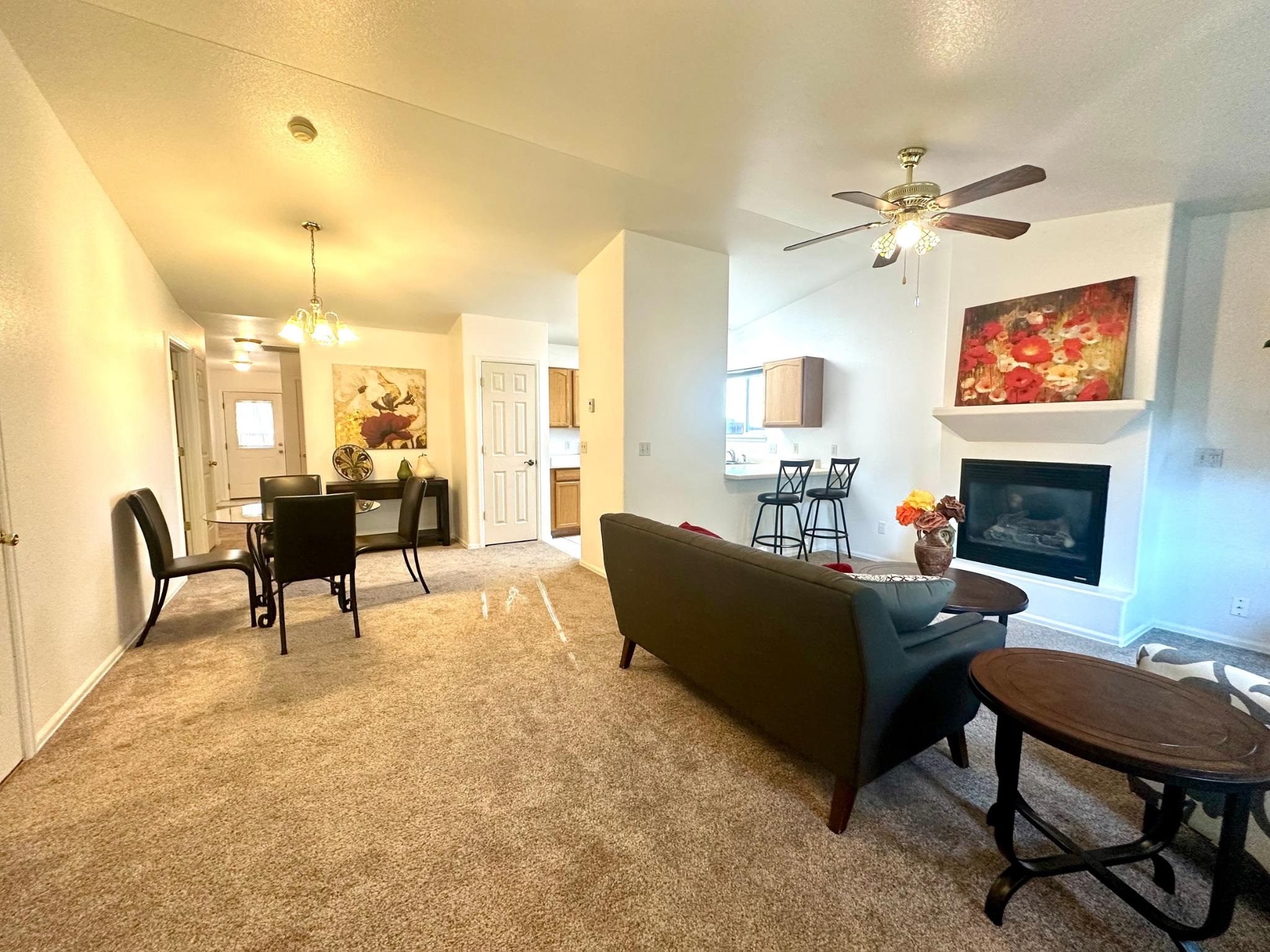656 Springbrook Drive Grand Junction, CO 81504 - Photo 3 of 32 a living room with furniture and a fireplace