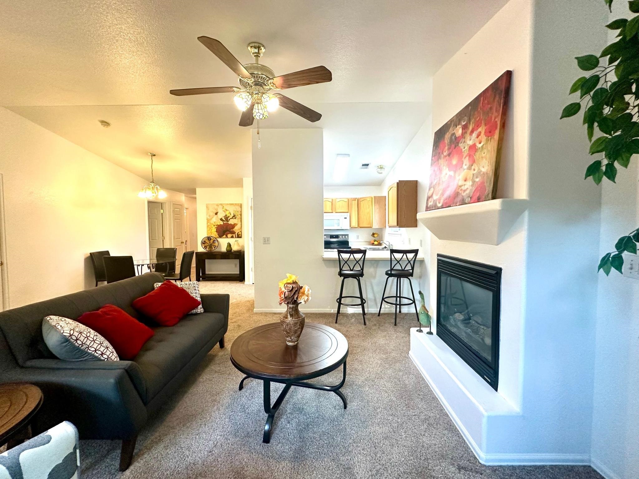 656 Springbrook Drive Grand Junction, CO 81504 - Photo 4 of 32 a living room with furniture and a fireplace