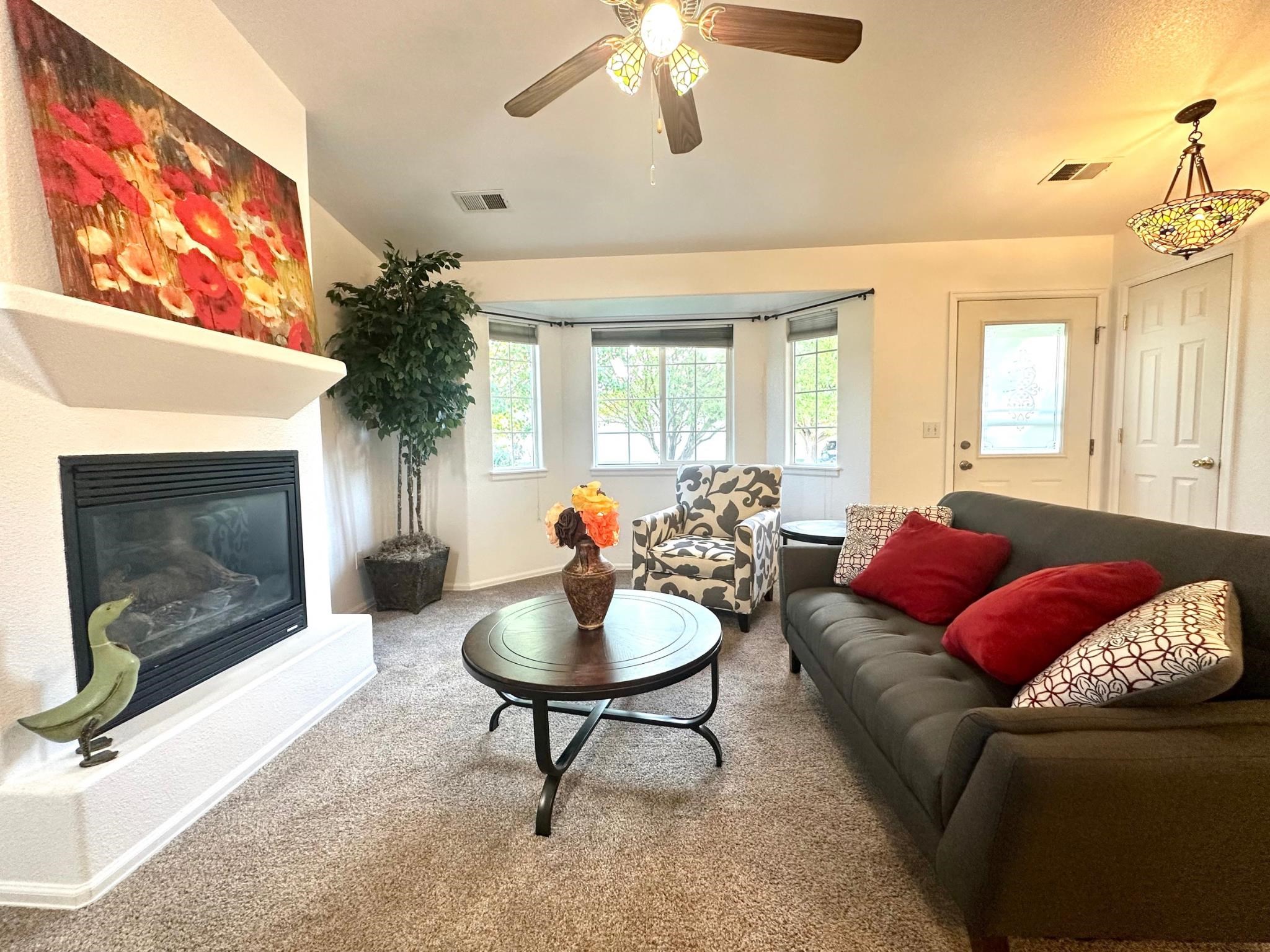 656 Springbrook Drive Grand Junction, CO 81504 - Photo 7 of 32 a living room with furniture and a fireplace