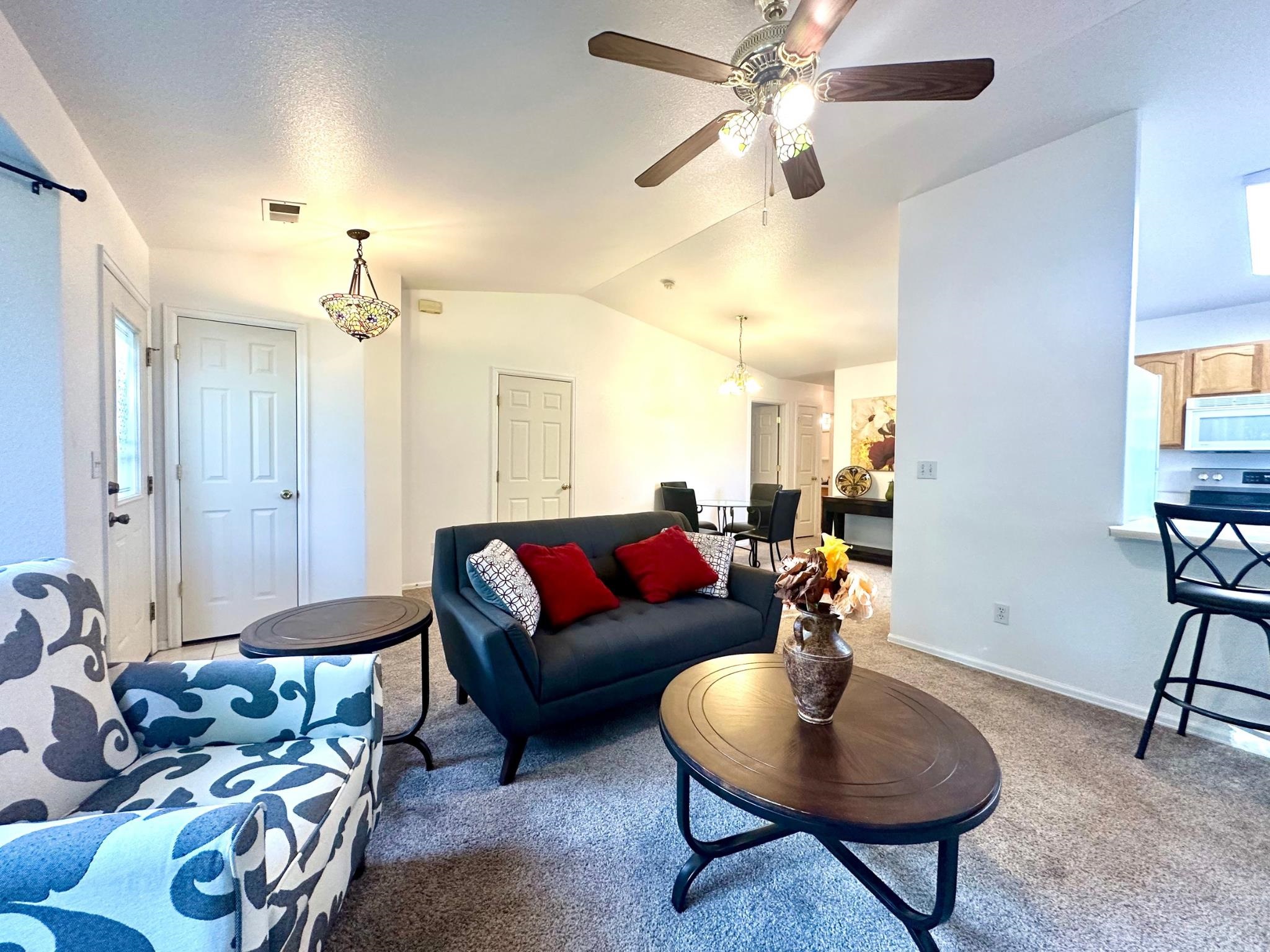 656 Springbrook Drive Grand Junction, CO 81504 - Photo 8 of 32 a living room with furniture and a chandelier