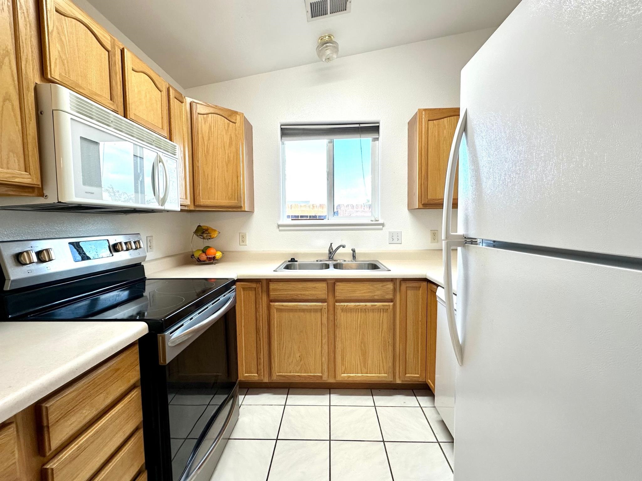 656 Springbrook Drive Grand Junction, CO 81504 - Photo 10 of 32 a kitchen with stainless steel appliances granite countertop a sink stove and cabinets