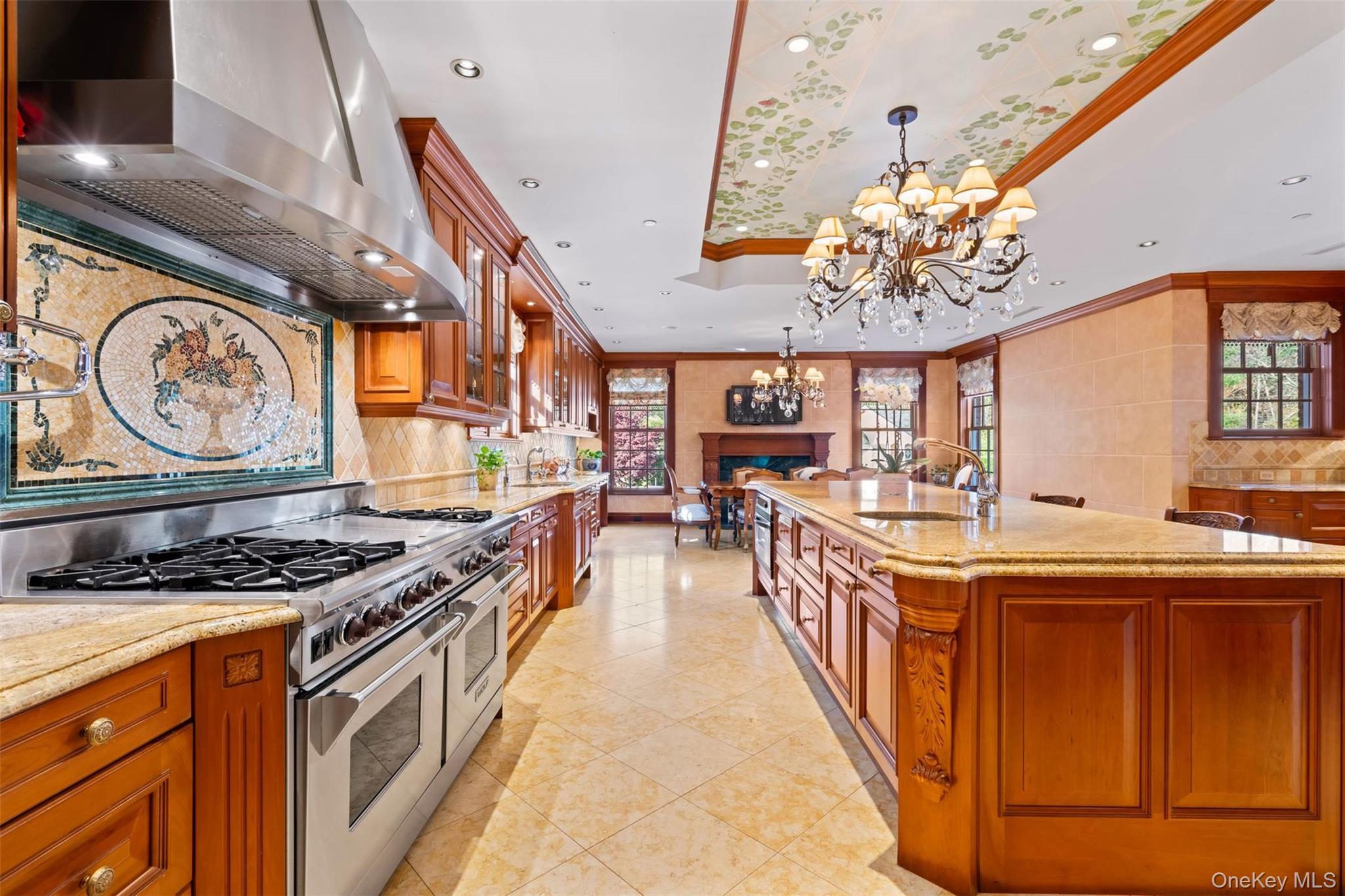 660 Chicken Valley Road Locust Valley, NY 11560 - Photo 14 of 48 a kitchen with stainless steel appliances granite countertop a stove and a dining table