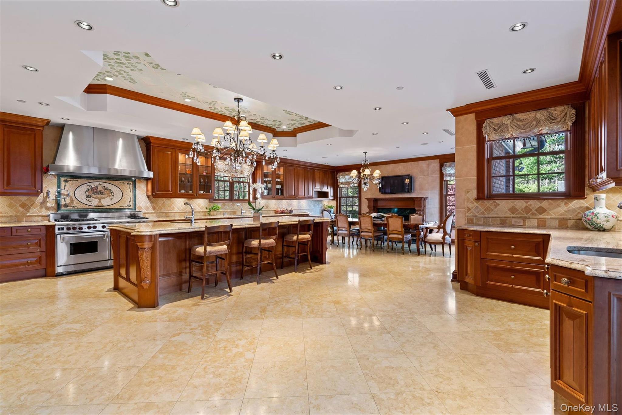 660 Chicken Valley Road Locust Valley, NY 11560 - Photo 15 of 48 Spacious kitchen with wood cabinetry and light-toned tile flooring