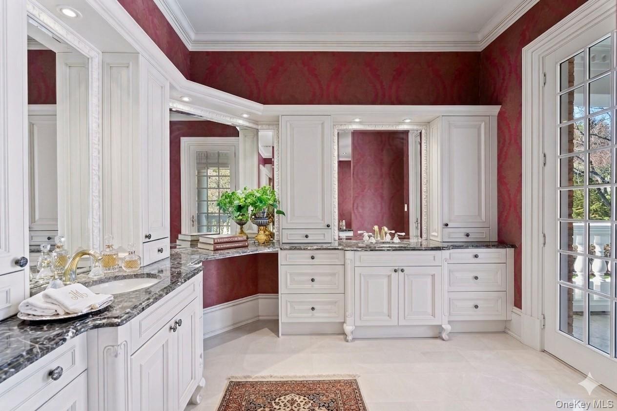 660 Chicken Valley Road Locust Valley, NY 11560 - Photo 25 of 48 a bathroom with a granite countertop sink and a mirror