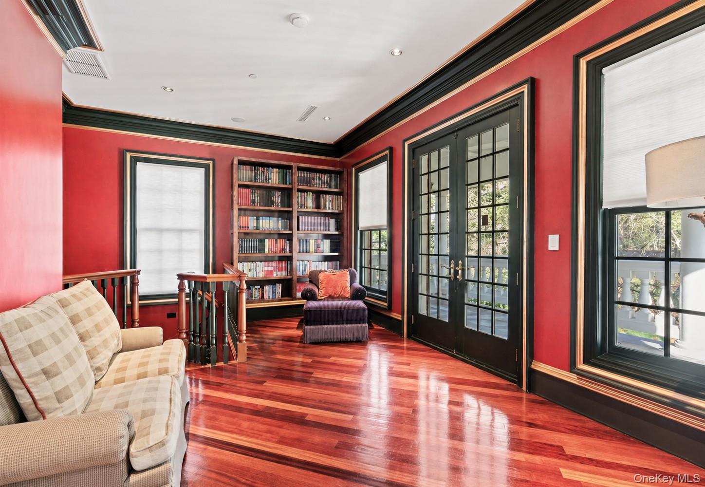 660 Chicken Valley Road Locust Valley, NY 11560 - Photo 27 of 48 Richly stained wood-finish flooring complements the vibrant walls