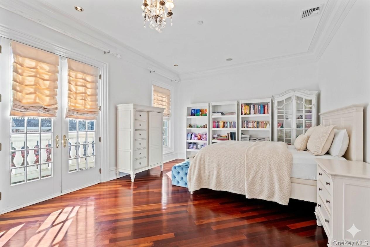660 Chicken Valley Road Locust Valley, NY 11560 - Photo 28 of 48 Rich wood-finish flooring complements crisp white walls and crown molding