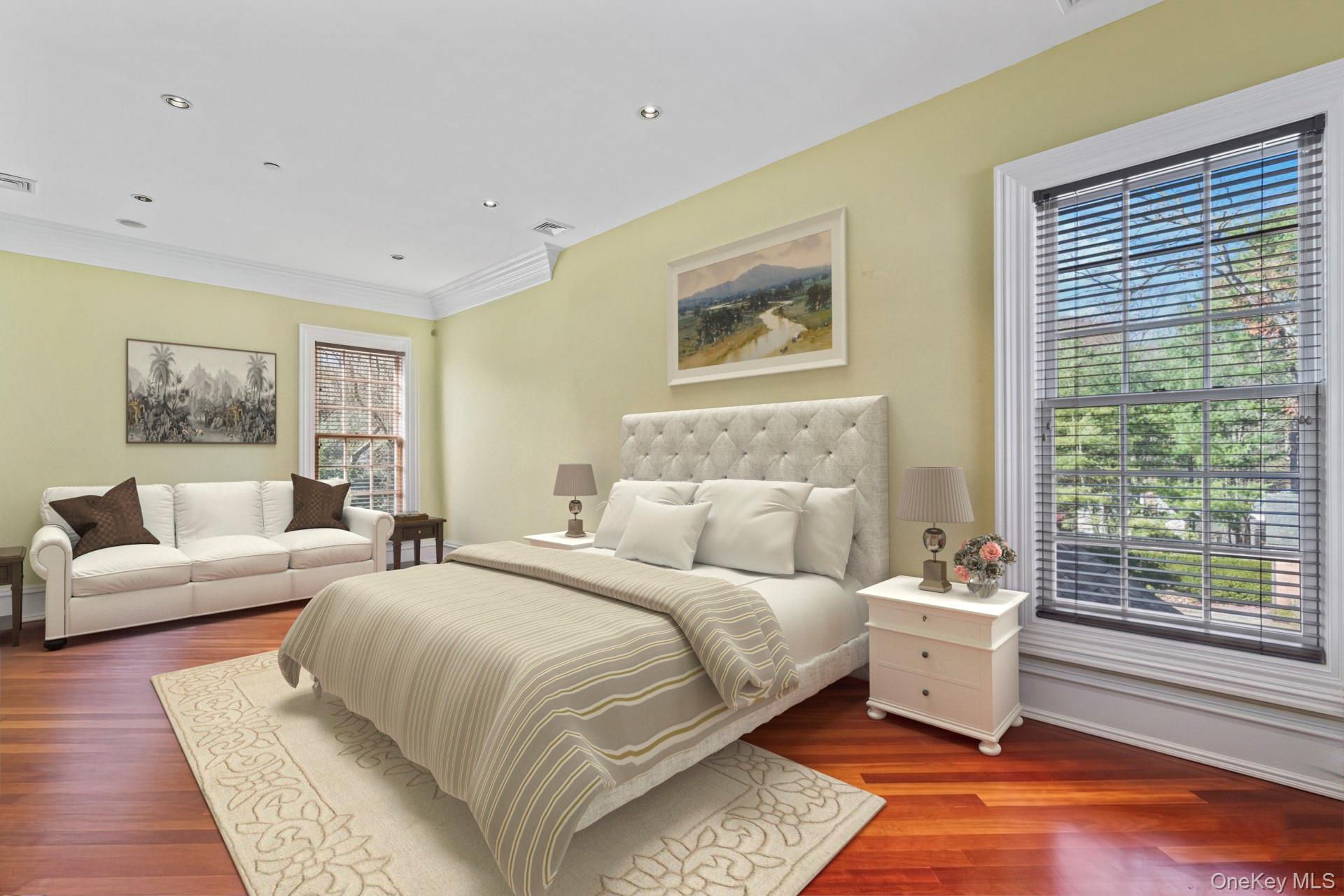 660 Chicken Valley Road Locust Valley, NY 11560 - Photo 32 of 48 a bedroom with a large bed and a couch